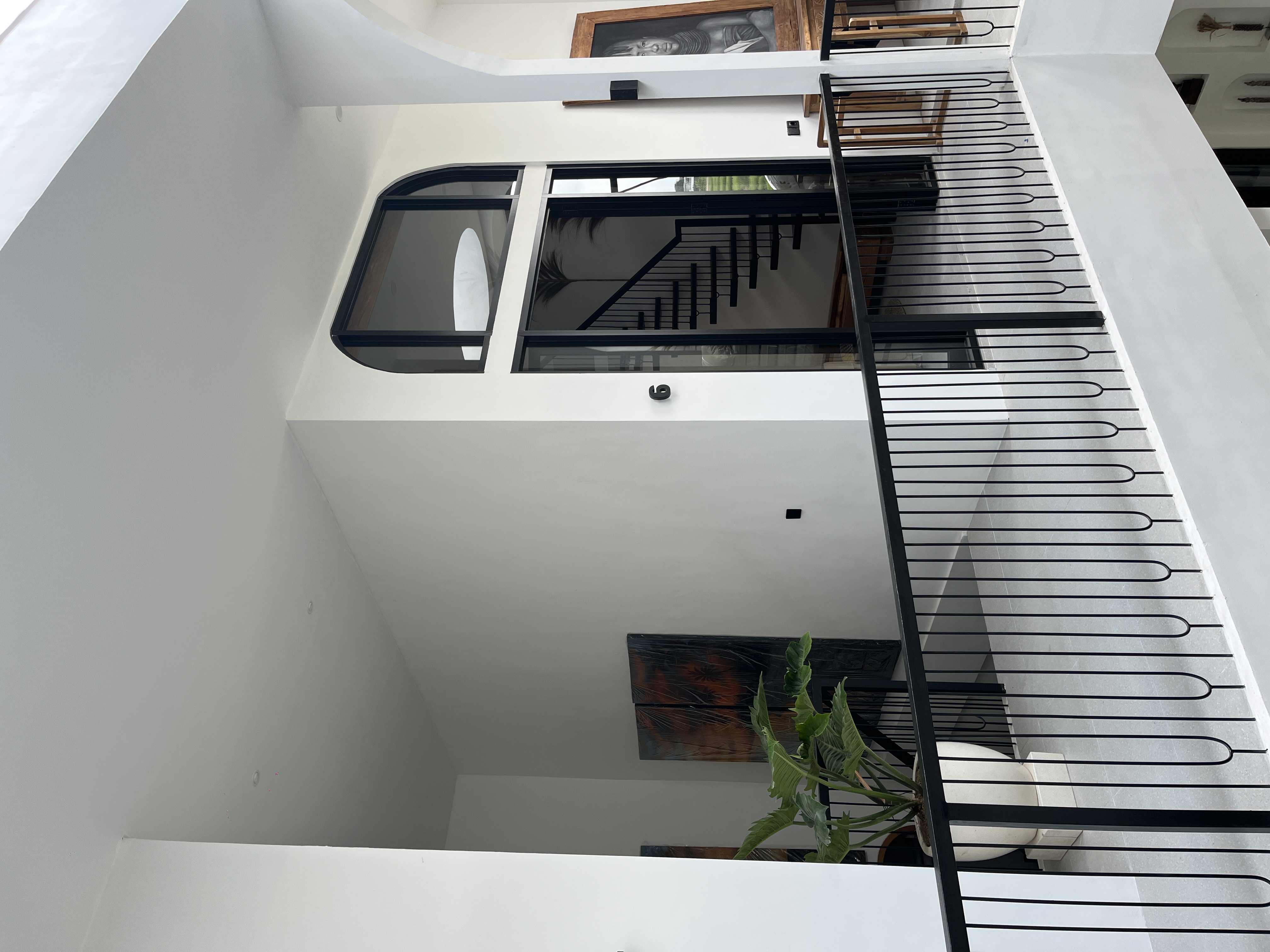 Upper floor walkway leading to room number 6